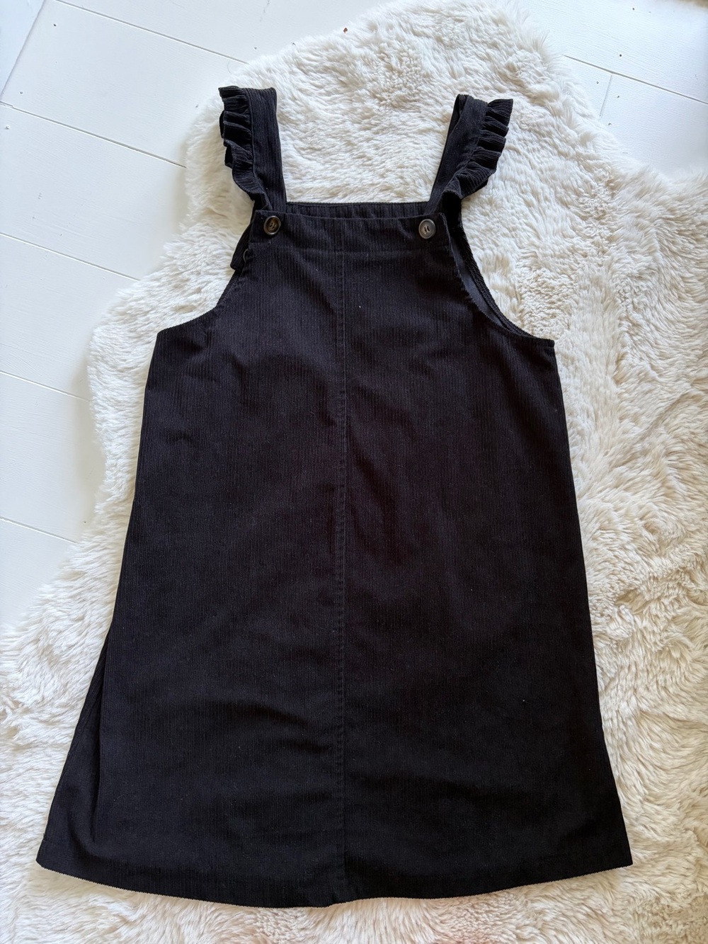 Black corduroy jumper with ruffle